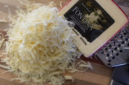 Fontina is a semi-hard cheese with mild, nutty flavor. It melts beautifully.