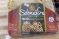 Naan makes a good flatbread. They are usually found in the deli areas of a grocery store. Costco sells them in smaller versions too.